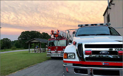 Dover fire trucks with sunset in background